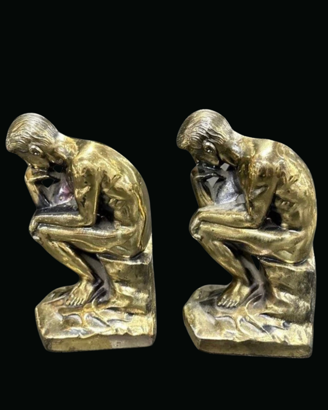 Pair of The Thinker bookends in brass finish cast metal, three-quarter view facing left