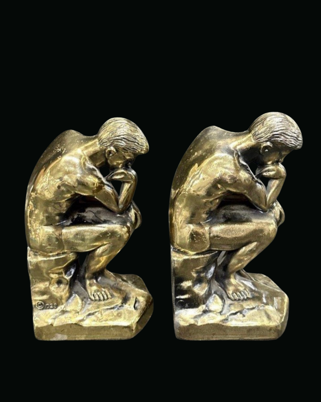 Pair of The Thinker bookends in brass finish cast metal, three-quarter view facing right