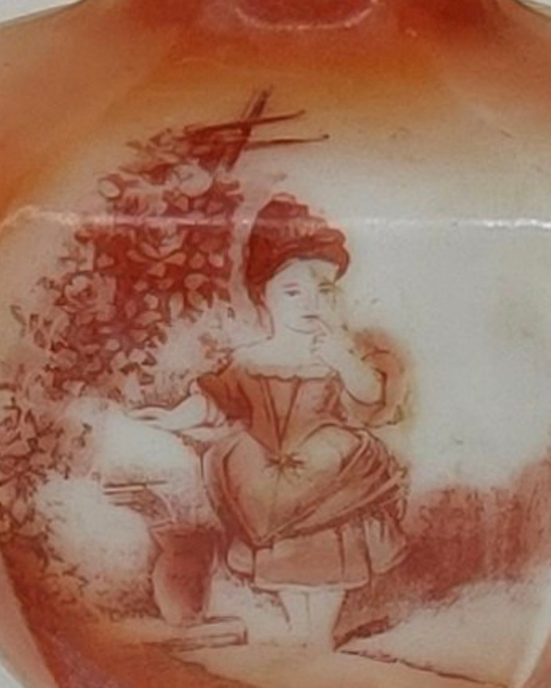 Close view of the printed scene on the opaline lamp font, a child in a garden beside a flowering trellis, IM-0106