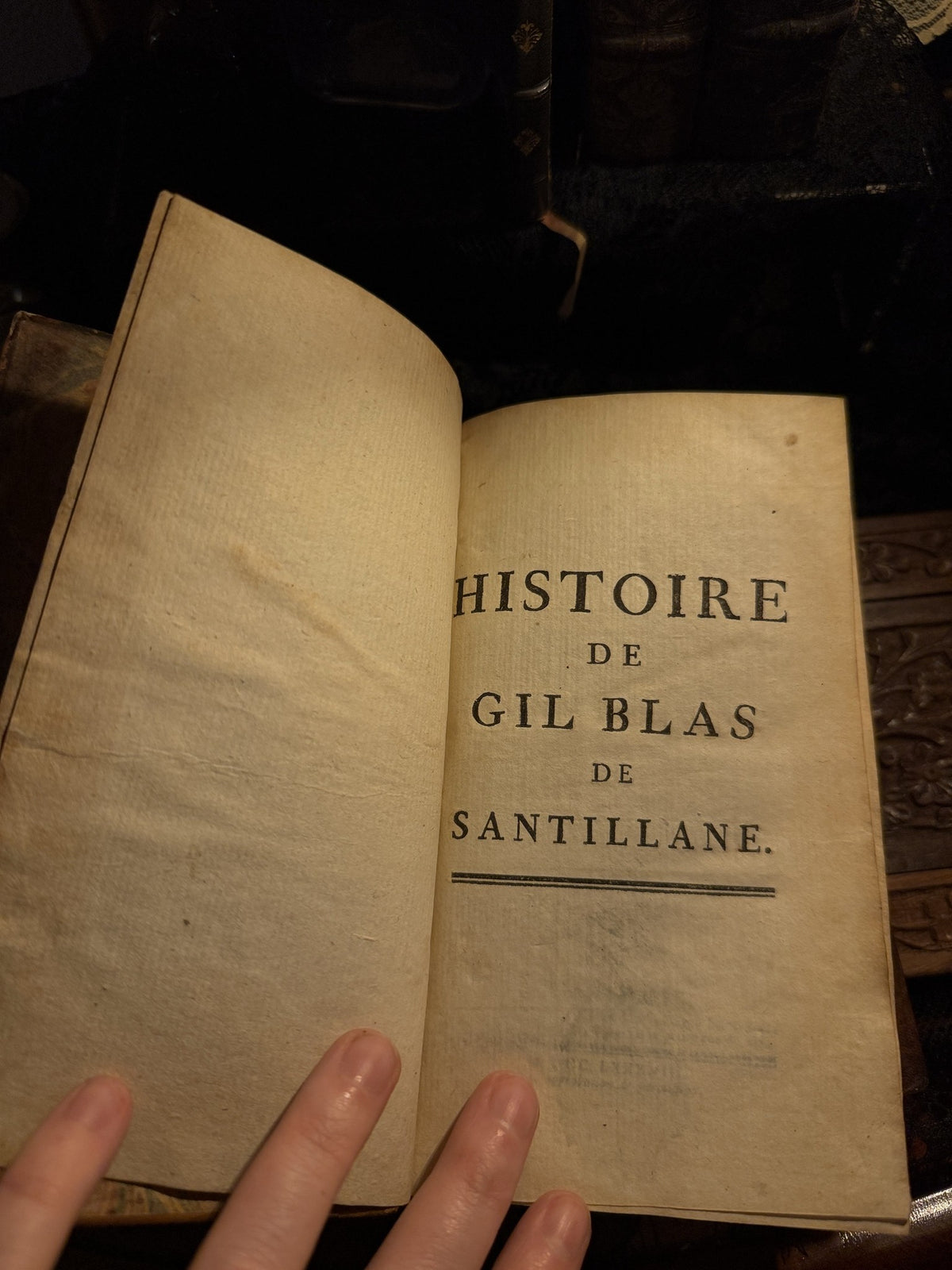 Half title reading Histoire de Gil Blas de Santillane, the book held open flat, IM-0054
